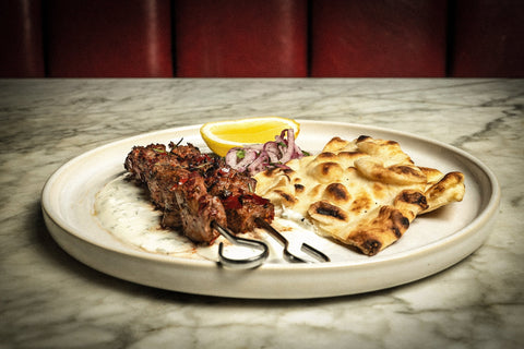 Spicy venison kebabs, garlic yoghurt, pickled sumac onions & flat bread